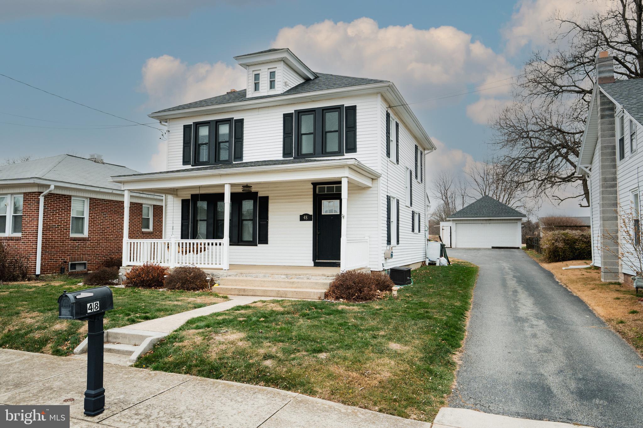 48 West High Street Windsor, PA 17366 - Photo 3 of 23 a front view of a house with a yard