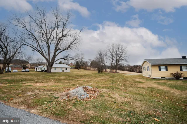 a view of open space with huge green field