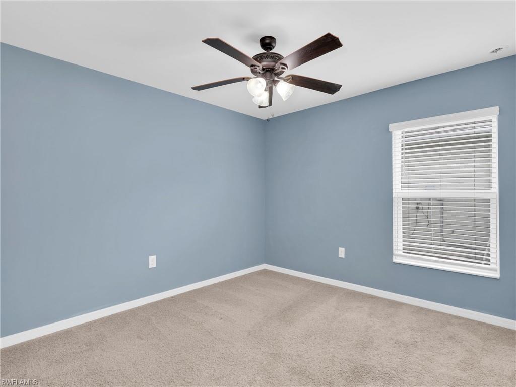 731 Hadley Place West Naples, FL 34104 - Photo 6 of 30 Bedroom 3 With Ceiling Fan And Faux Wood Blinds