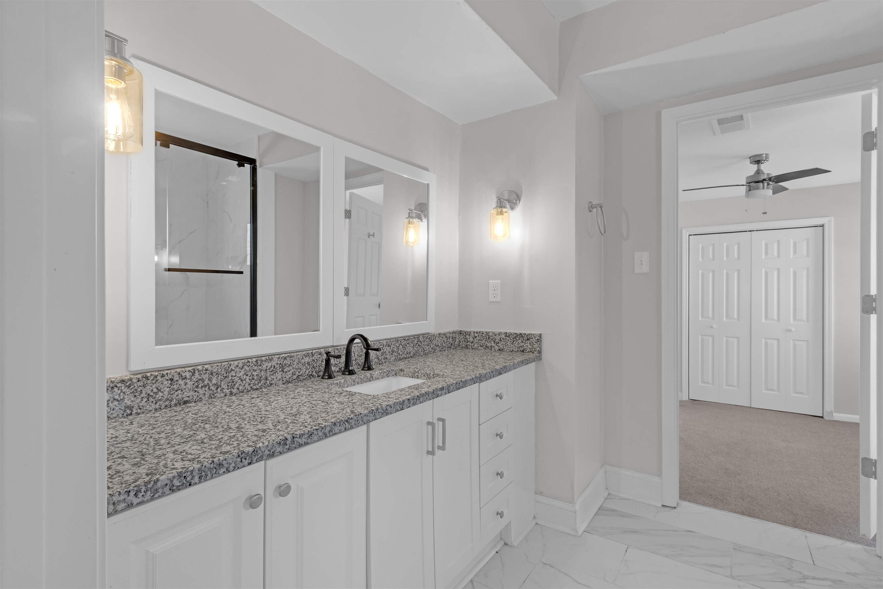 1296 Monasco Road Millington, TN 38053 - Photo 14 of 32 a bathroom with a granite countertop sink and a mirror