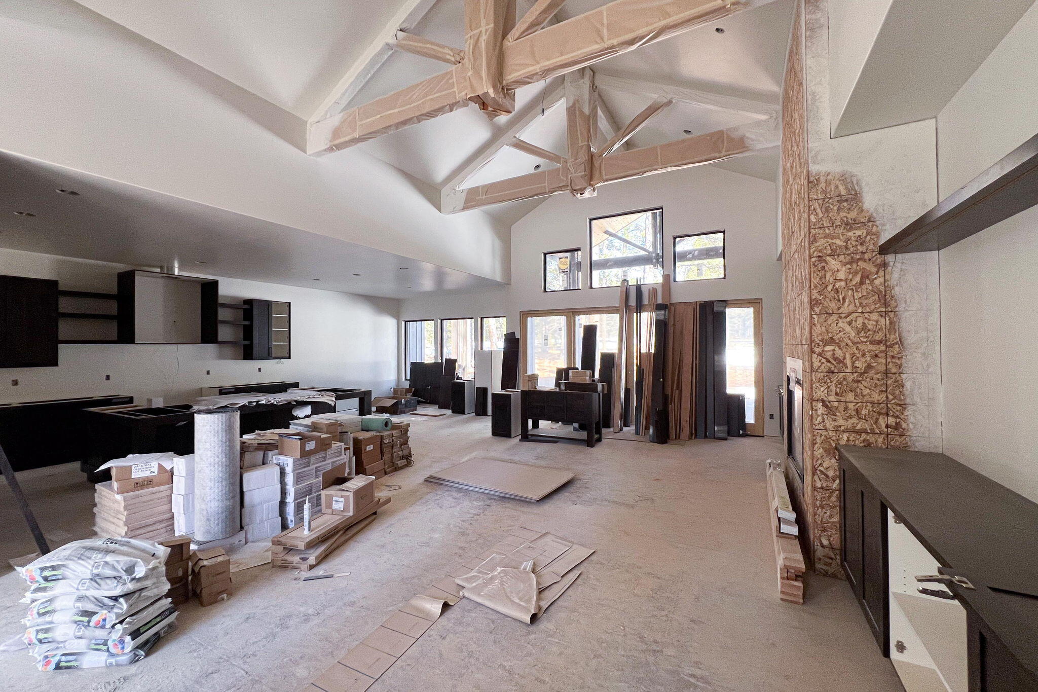 56337 Mirror Rock Loop, Unit 334 Bend, OR 97707 - Photo 8 of 34 Great room interior with vaulted ceiling and custom beam and truss work