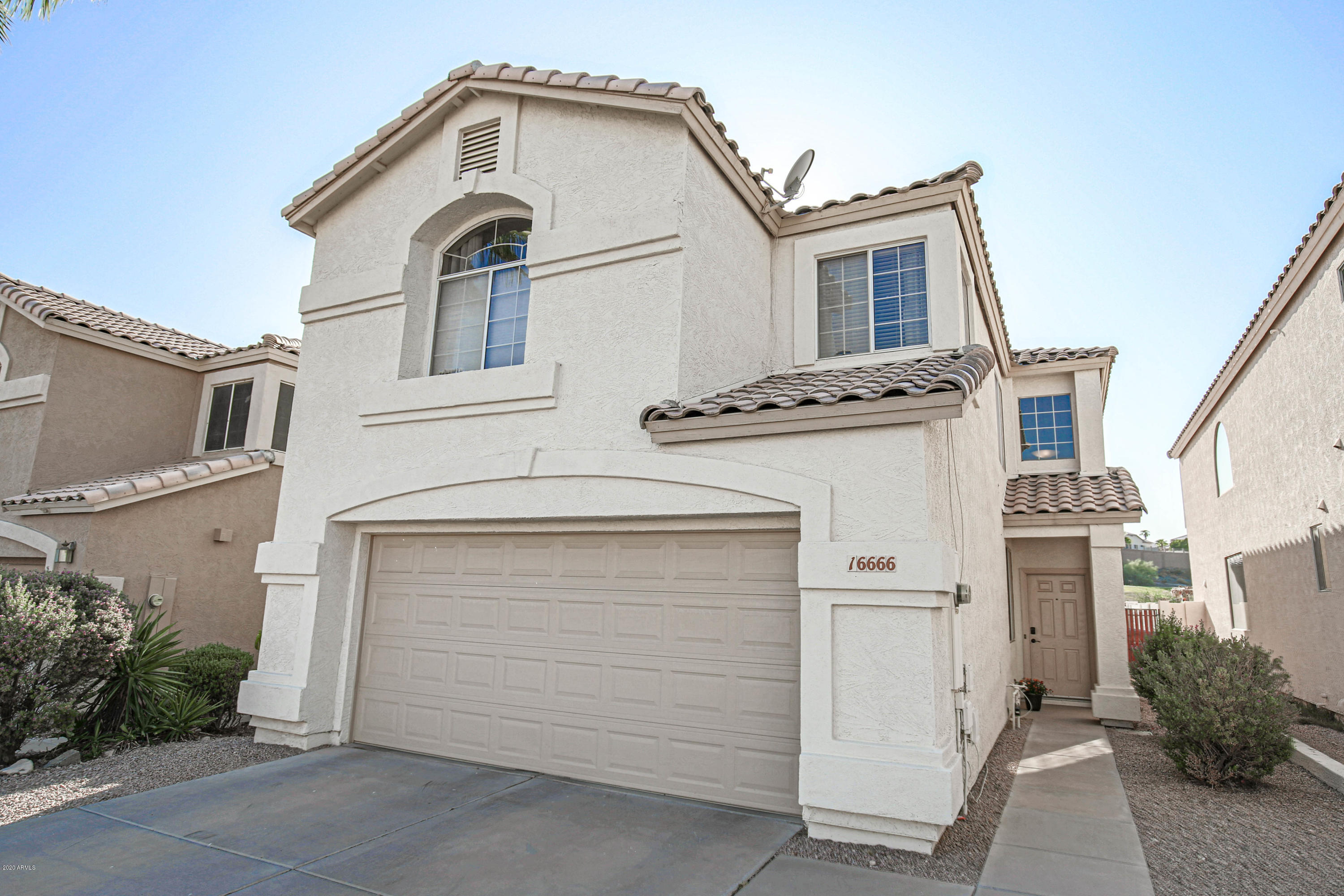 16666 South 21st Street Phoenix, AZ 85048 - Photo 1 of 43 a front view of a house with a garage