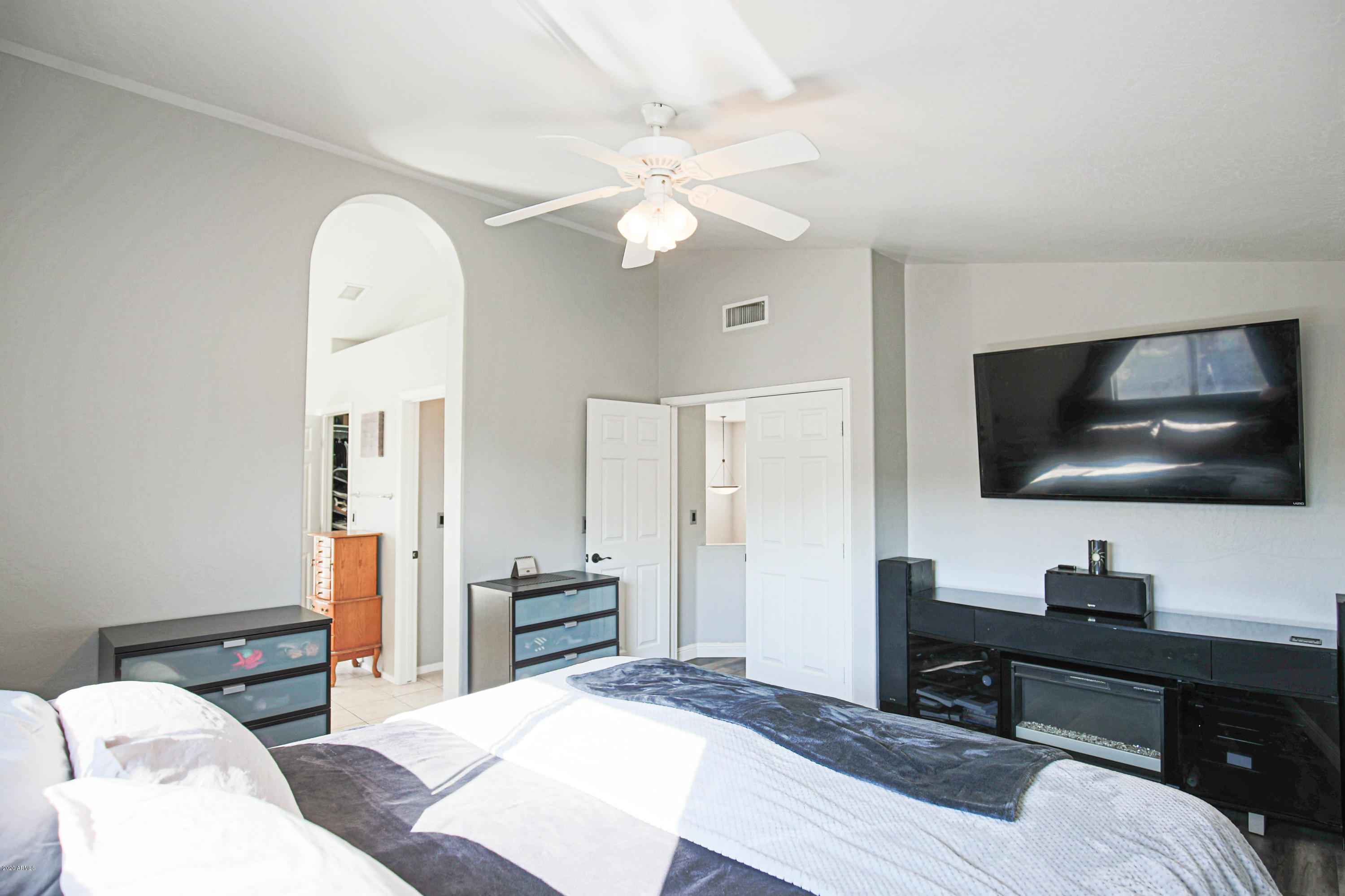 16666 South 21st Street Phoenix, AZ 85048 - Photo 19 of 43 a bedroom with a bed and a flat screen tv