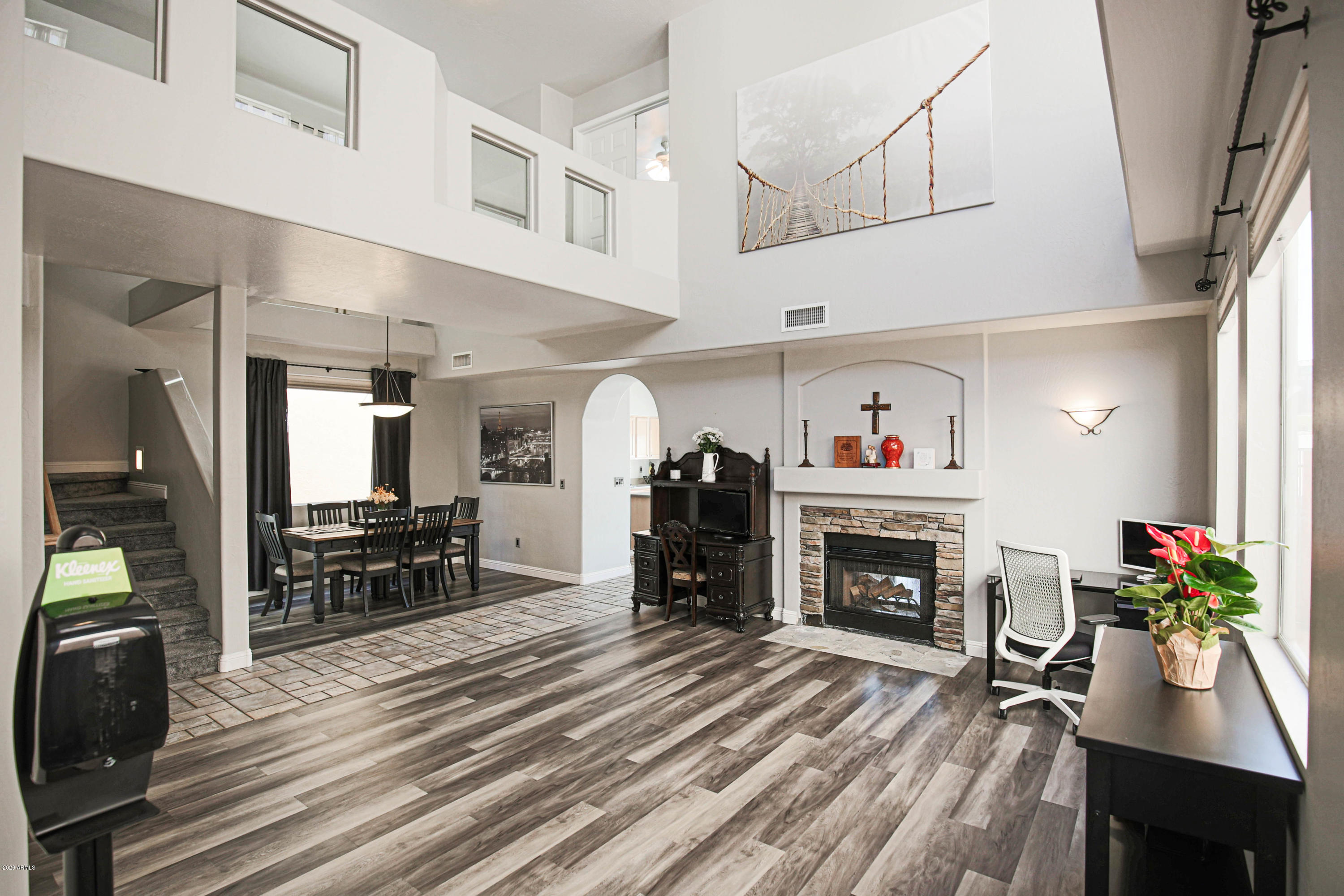 16666 South 21st Street Phoenix, AZ 85048 - Photo 2 of 43 a living room with furniture flat screen tv and a fireplace