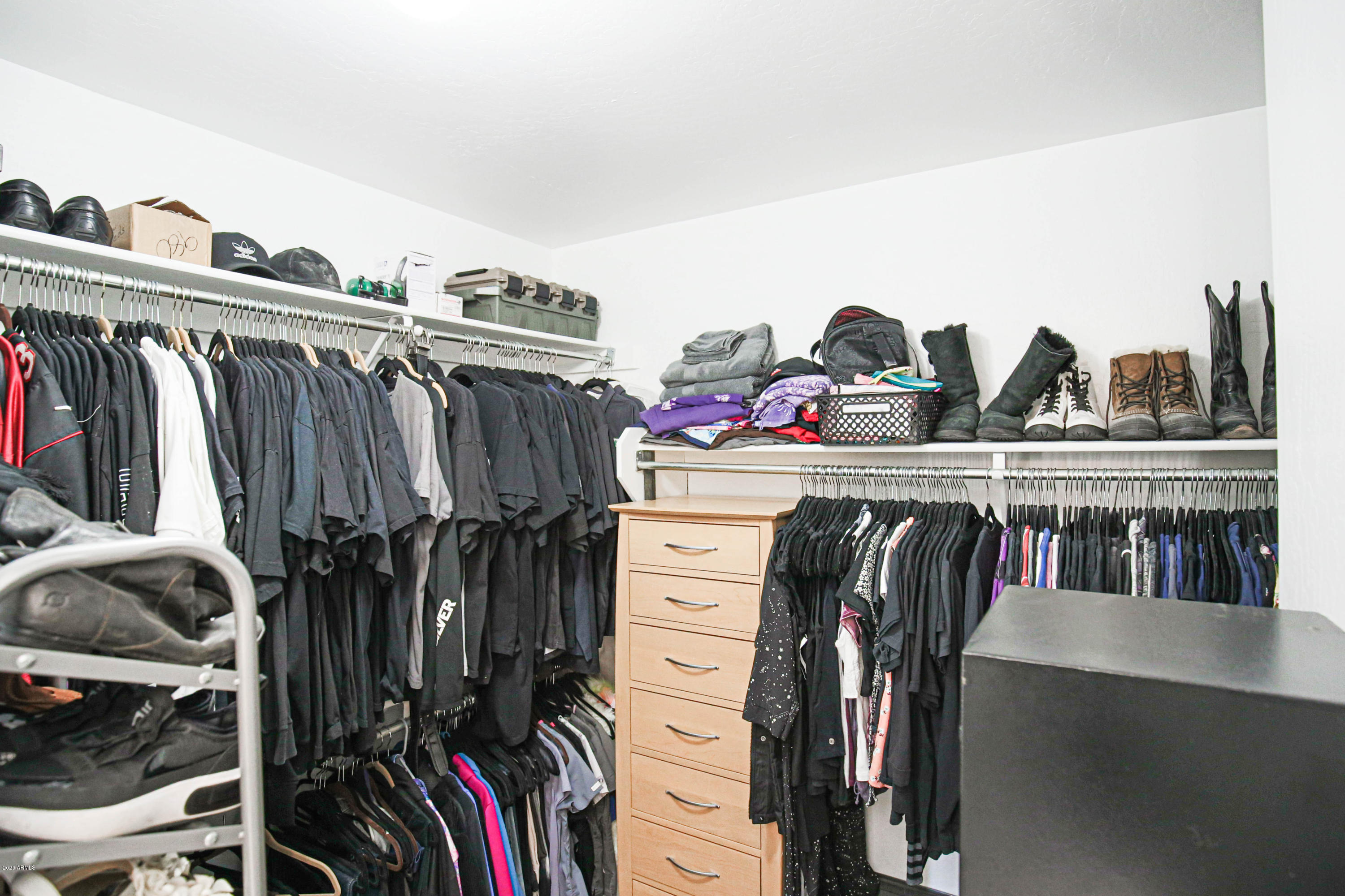 16666 South 21st Street Phoenix, AZ 85048 - Photo 23 of 43 a view of walk in closet with clothes and shoes