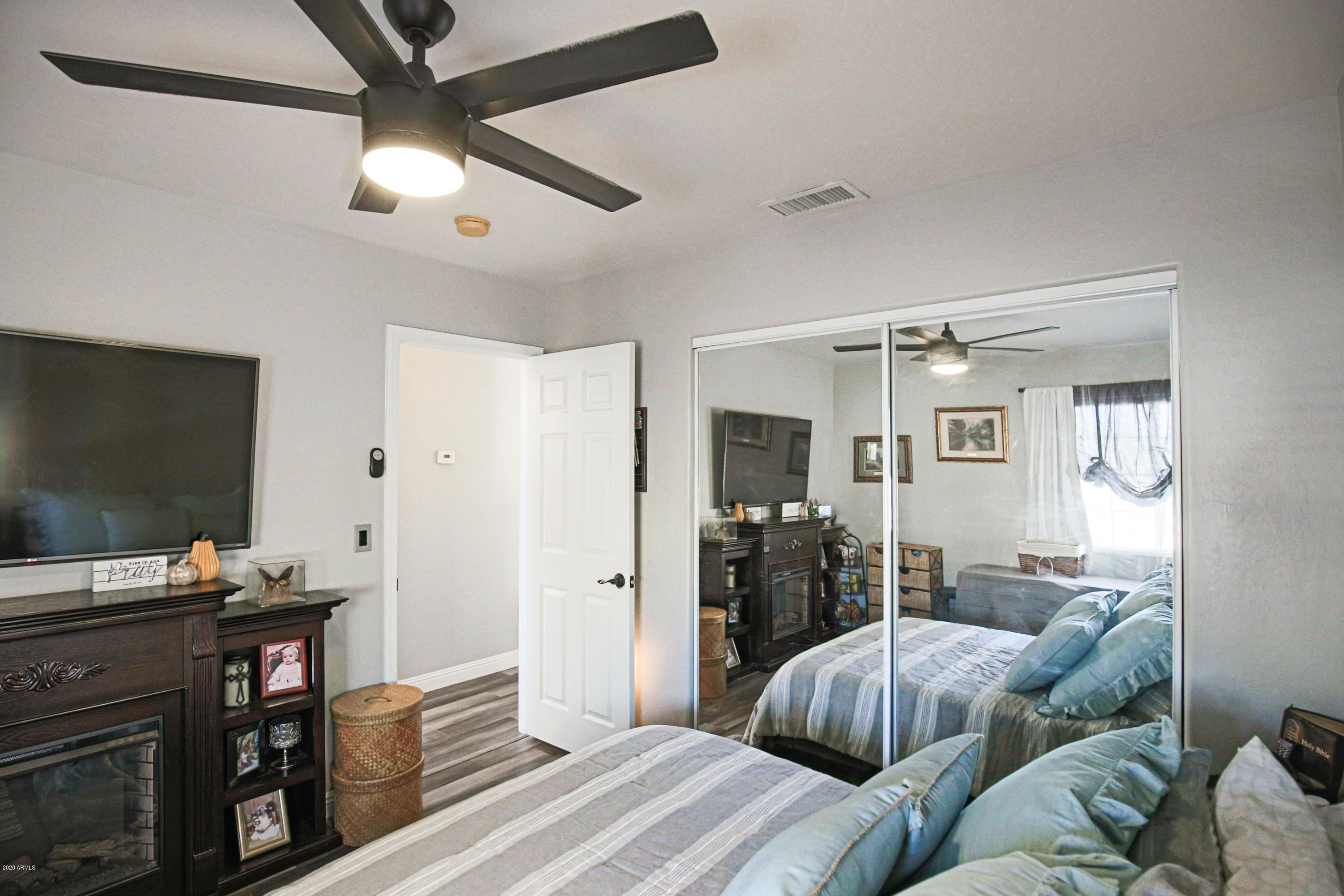 16666 South 21st Street Phoenix, AZ 85048 - Photo 26 of 43 a bedroom with furniture and a flat screen tv
