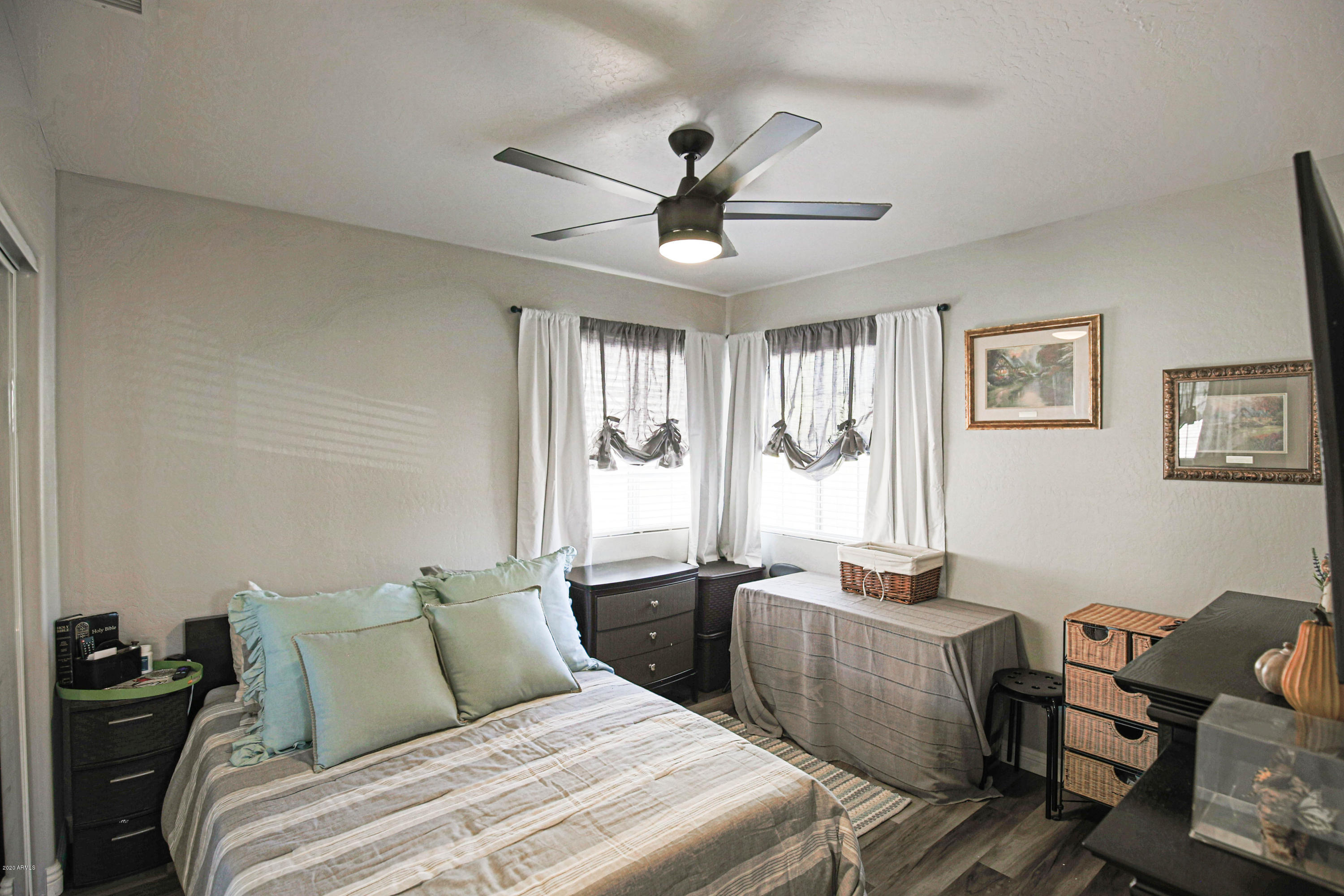 16666 South 21st Street Phoenix, AZ 85048 - Photo 27 of 43 a bedroom with a bed and a chandelier