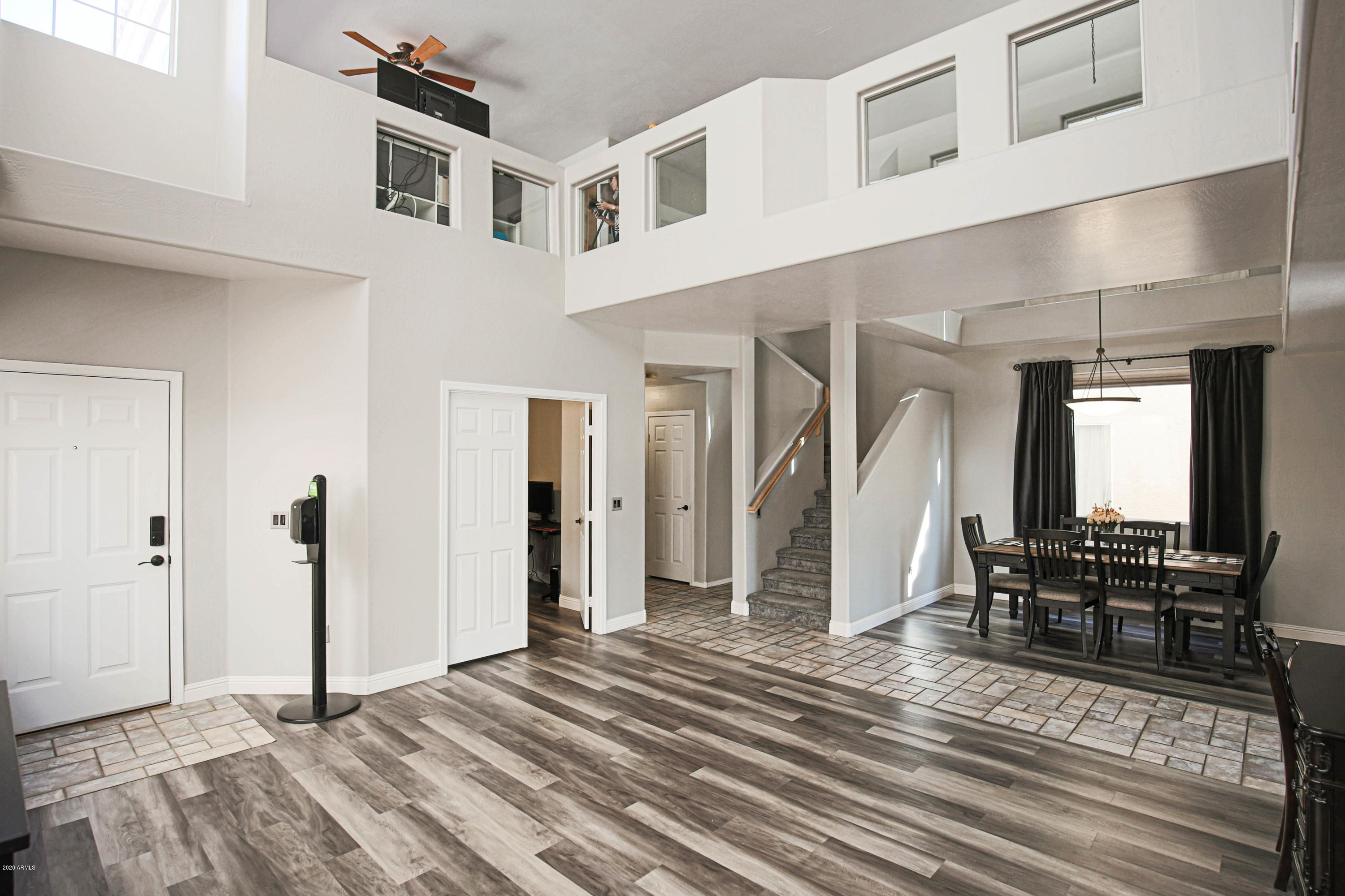 16666 South 21st Street Phoenix, AZ 85048 - Photo 3 of 43 a view of a hallway with wooden floor and furniture