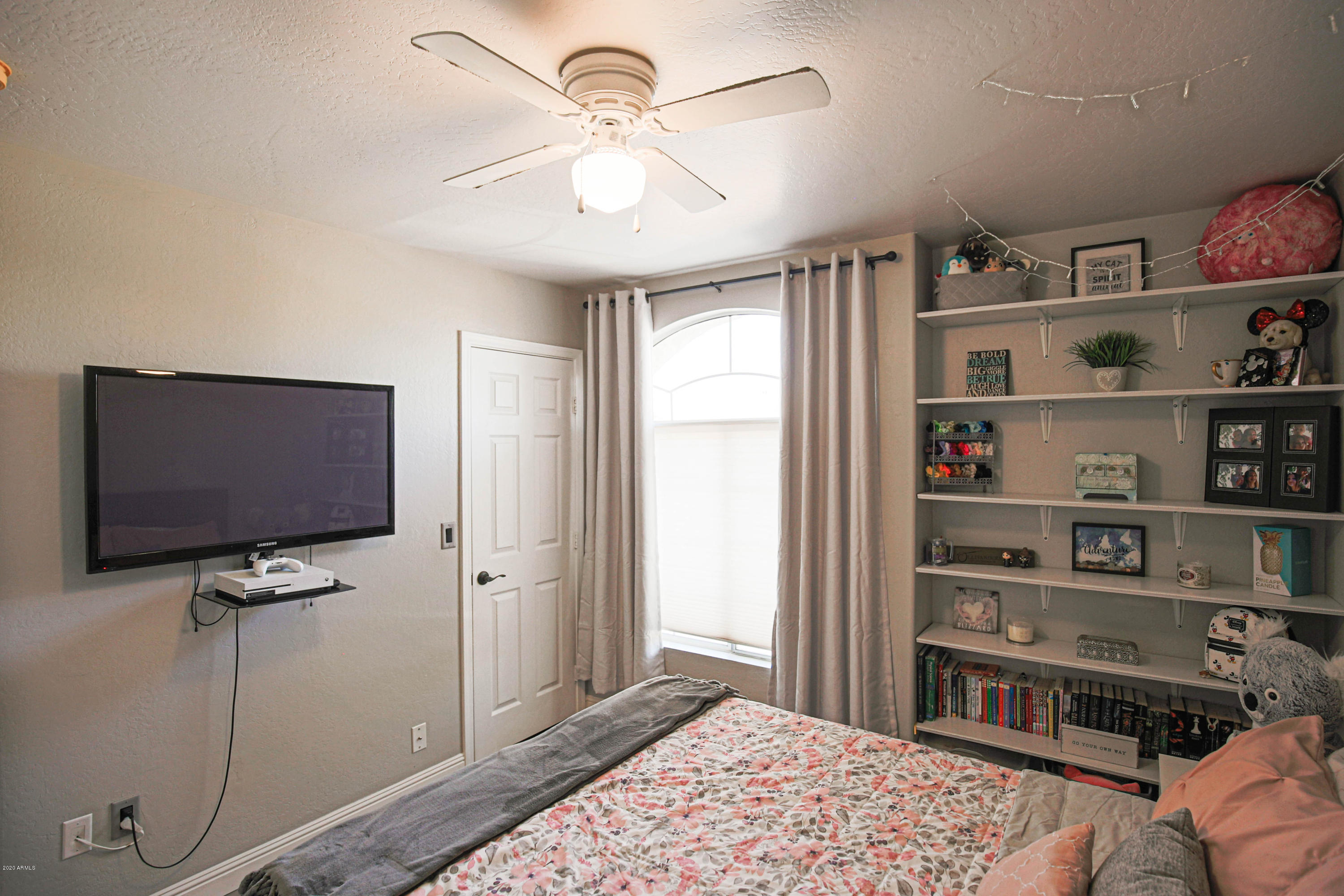 16666 South 21st Street Phoenix, AZ 85048 - Photo 32 of 43 a bedroom with furniture and a flat screen tv