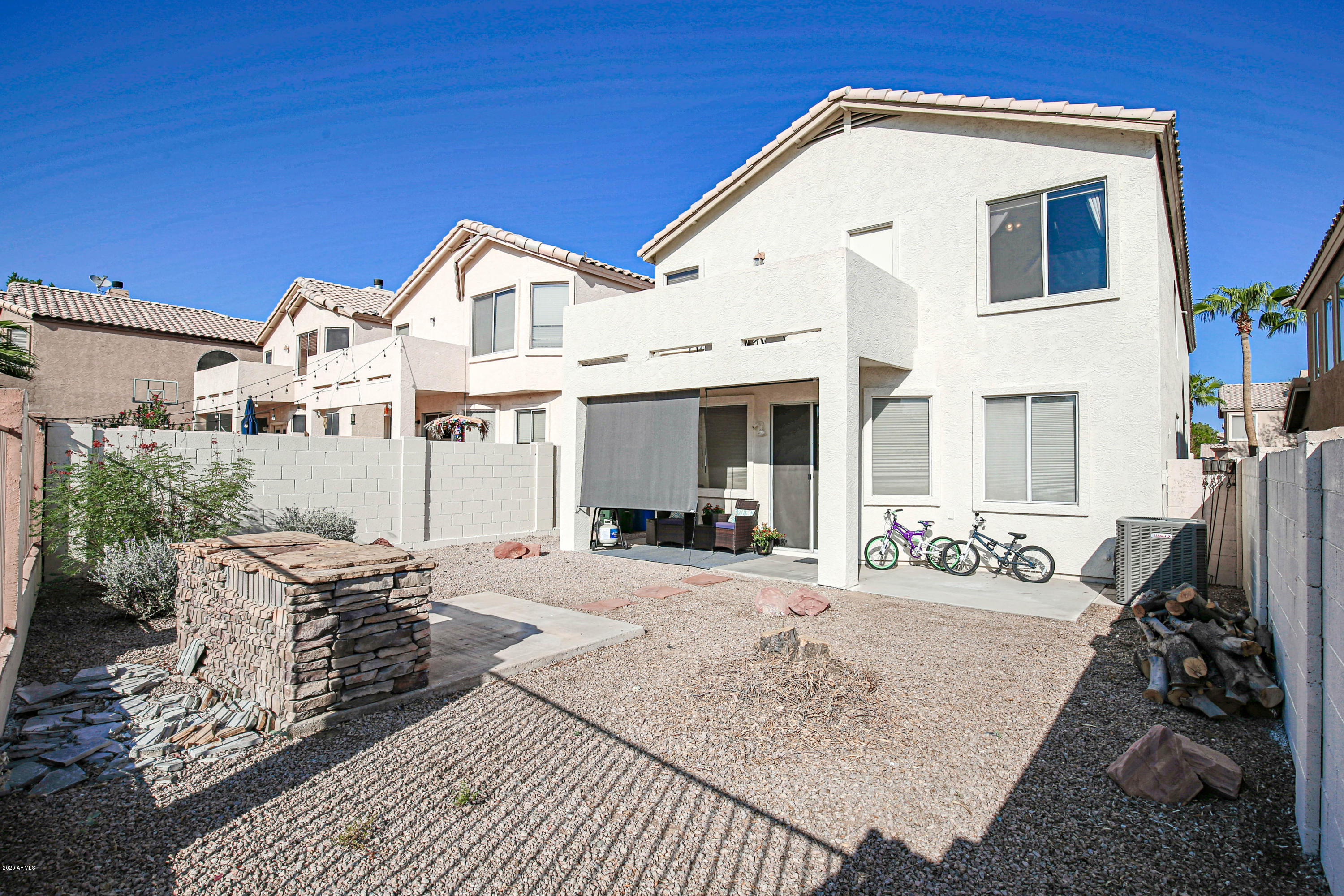 16666 South 21st Street Phoenix, AZ 85048 - Photo 33 of 43 a view of a white house with large windows and couches