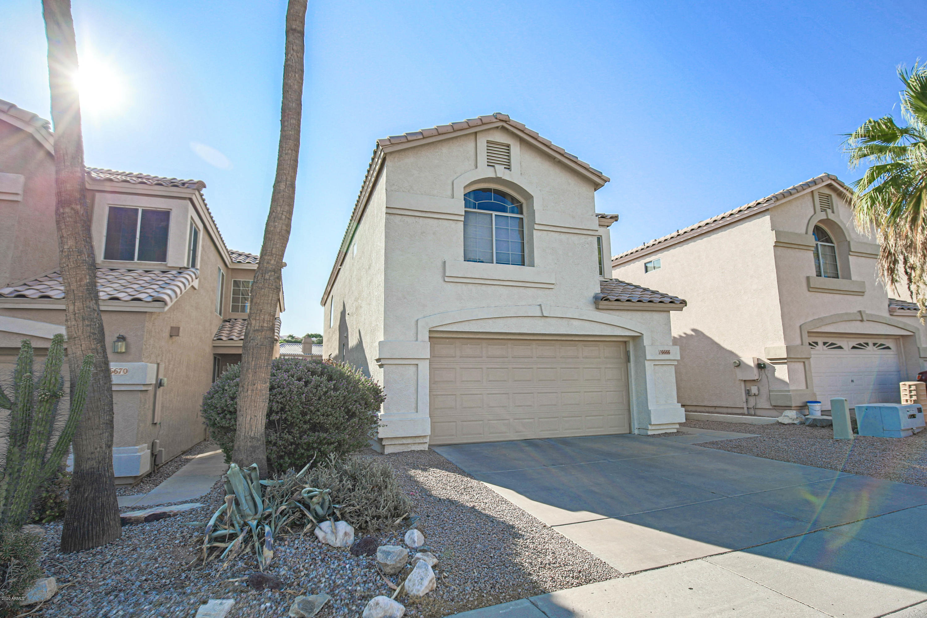 16666 South 21st Street Phoenix, AZ 85048 - Photo 35 of 43 a front view of a house with a yard