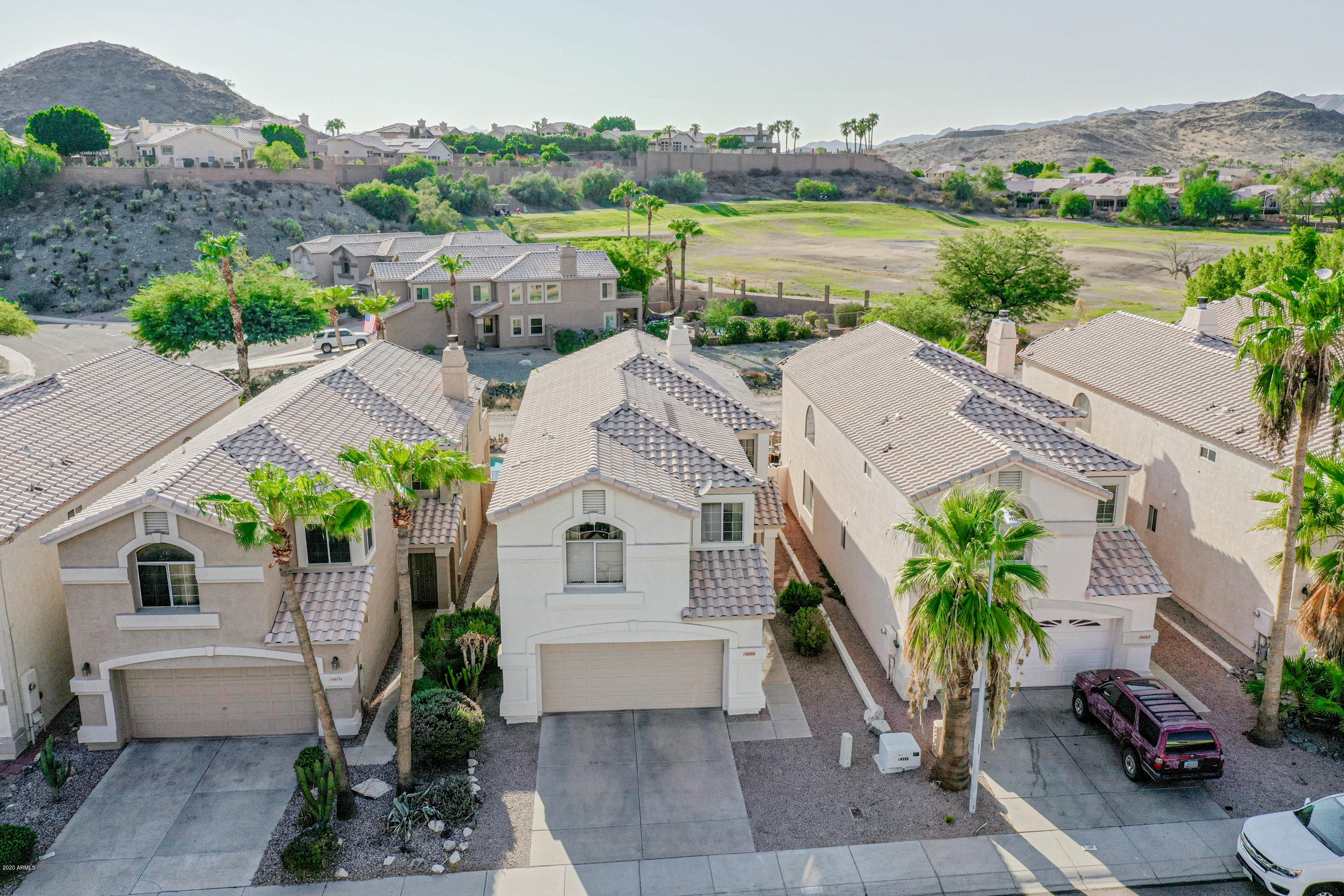 16666 South 21st Street Phoenix, AZ 85048 - Photo 40 of 43 an aerial view of a house with garden space and lake view