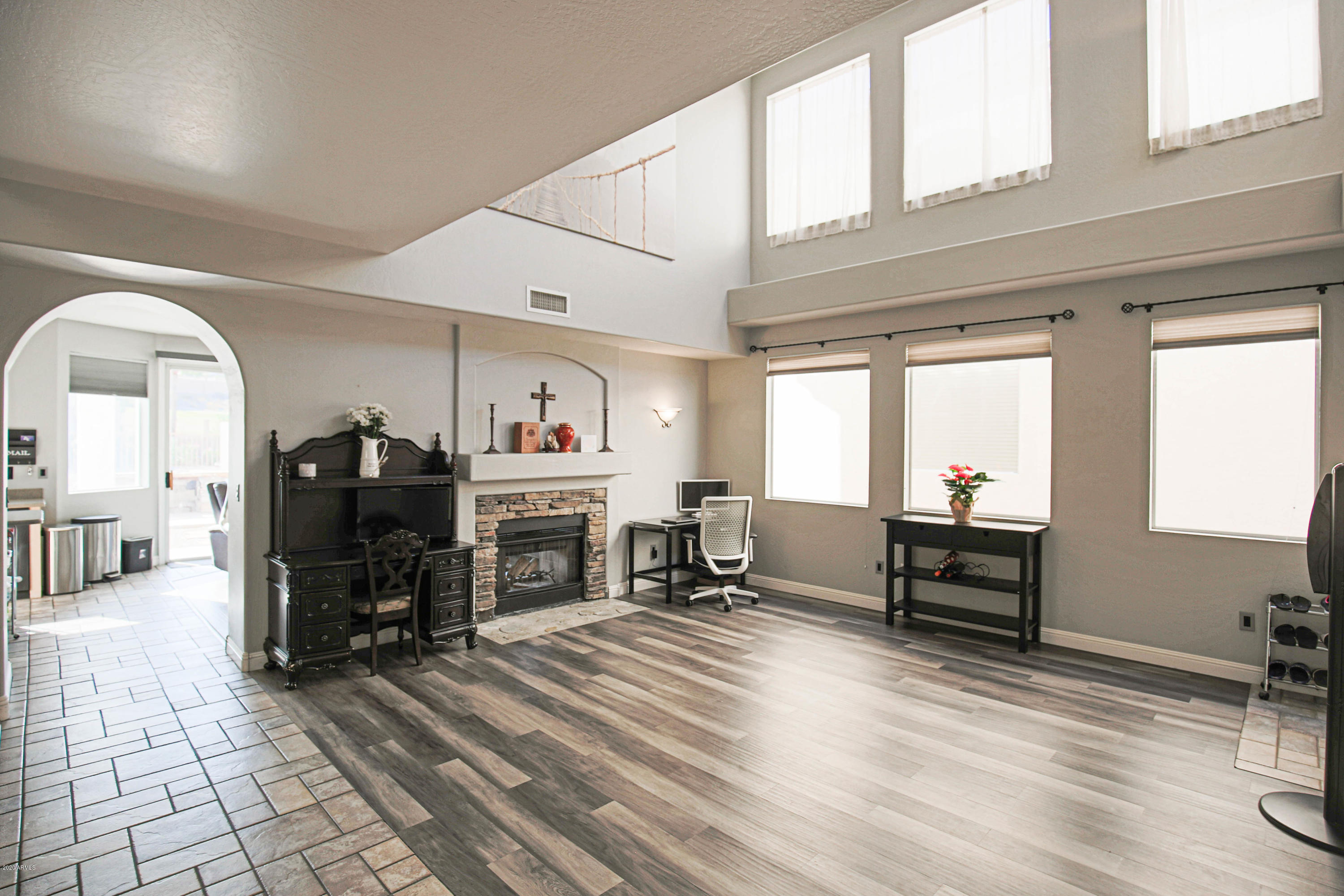 16666 South 21st Street Phoenix, AZ 85048 - Photo 6 of 43 a living room with furniture and a fireplace