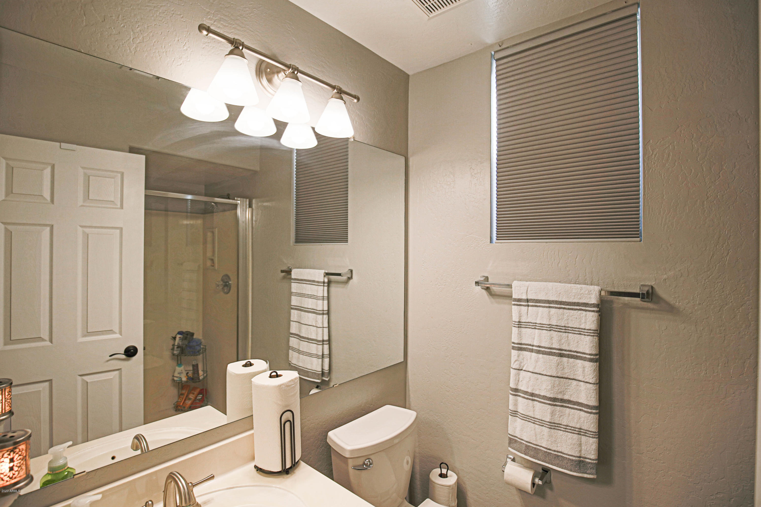 16666 South 21st Street Phoenix, AZ 85048 - Photo 10 of 43 a bathroom with a sink a toilet and shower