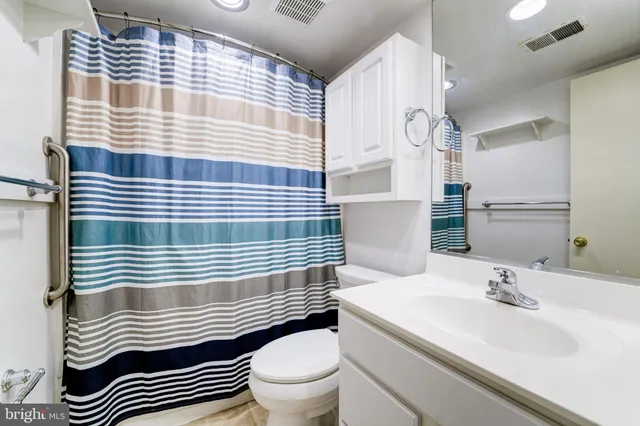 a bathroom with a sink and toilet