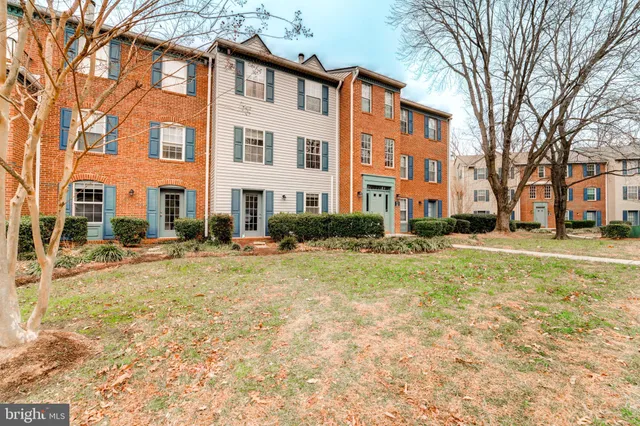a view of a building with a yard