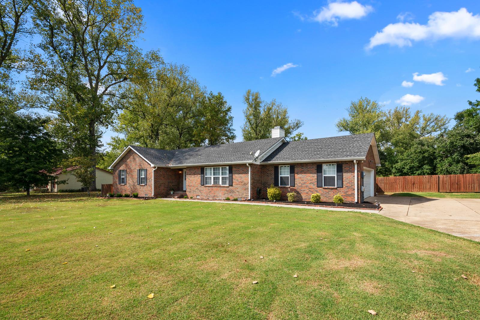 682 Baker Road Columbia, TN 38401 - Photo 2 of 30 a view of a house with a big yard and large trees