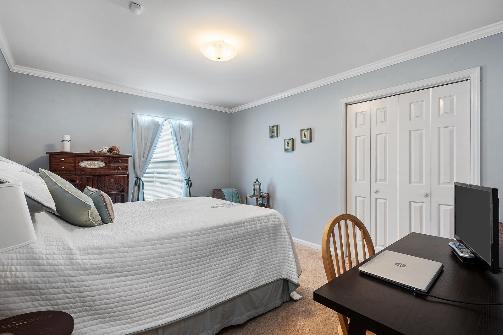 682 Baker Road Columbia, TN 38401 - Photo 20 of 30 a bedroom with a bed and a desk