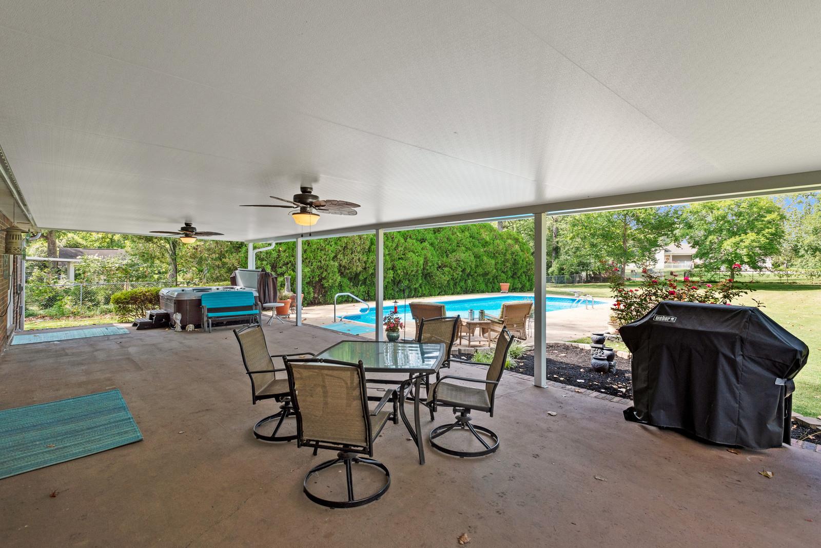 682 Baker Road Columbia, TN 38401 - Photo 23 of 30 a view of a patio with a table chairs and a yard