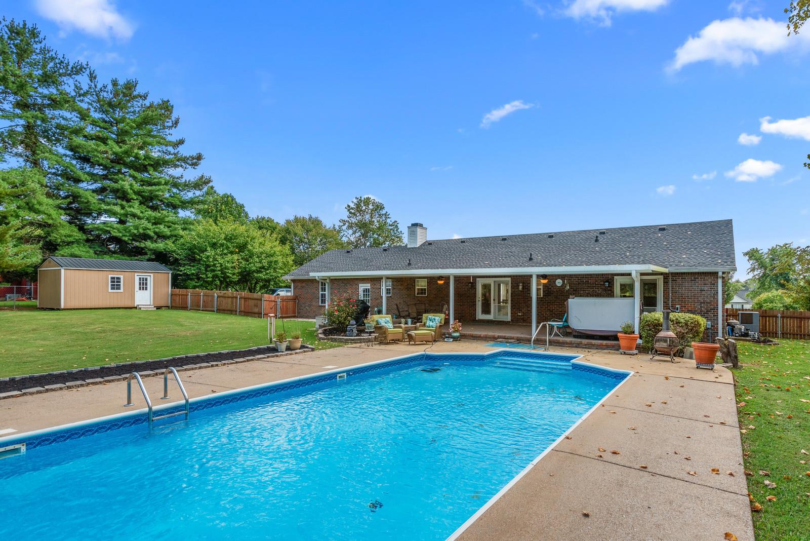 682 Baker Road Columbia, TN 38401 - Photo 25 of 30 a view of a house with a yard patio and fire pit