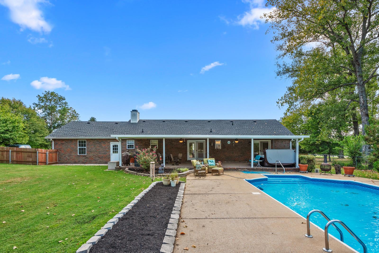 682 Baker Road Columbia, TN 38401 - Photo 26 of 30 a front view of a house with a yard table and chairs