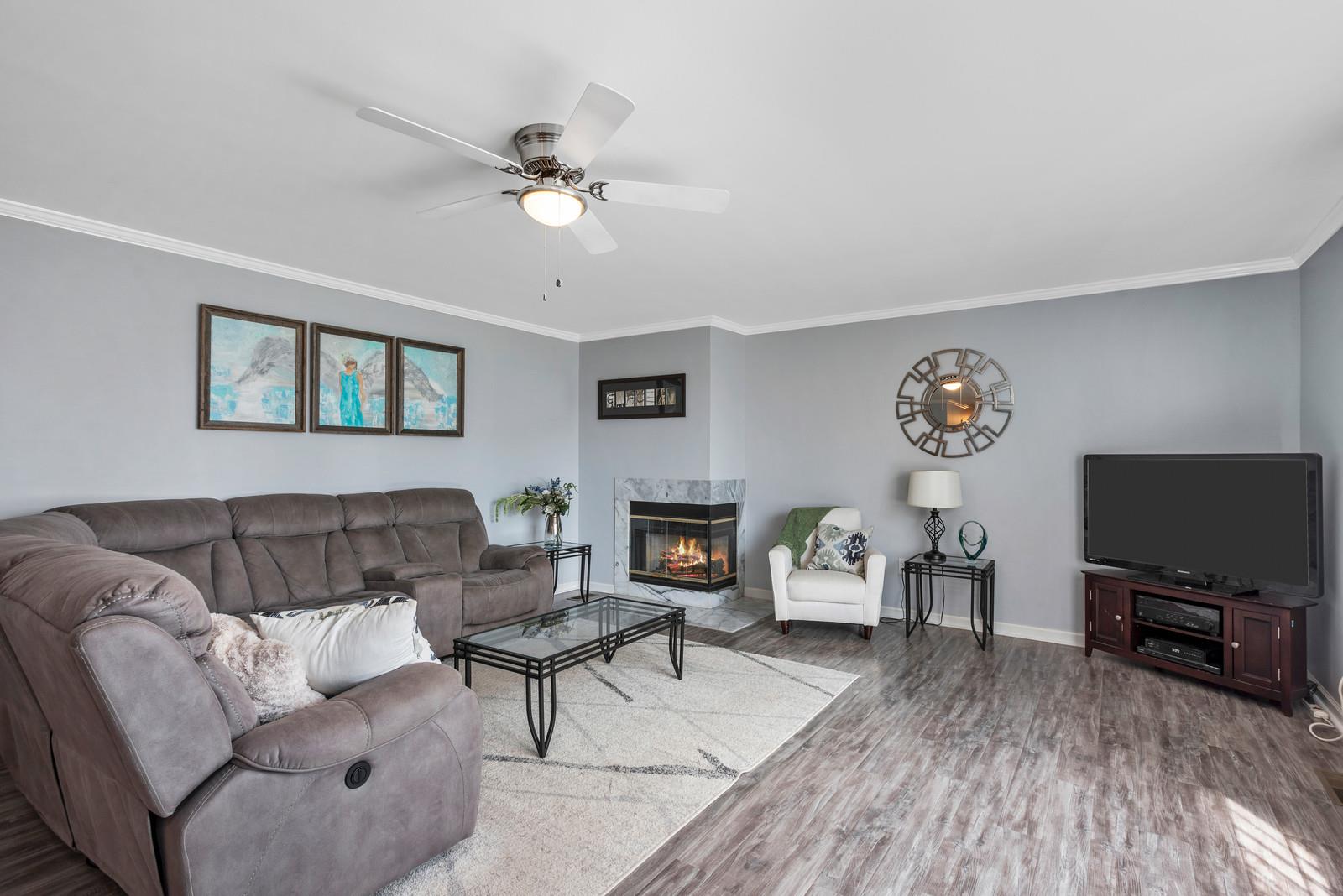 682 Baker Road Columbia, TN 38401 - Photo 30 of 30 a living room with furniture a fireplace and a flat screen tv