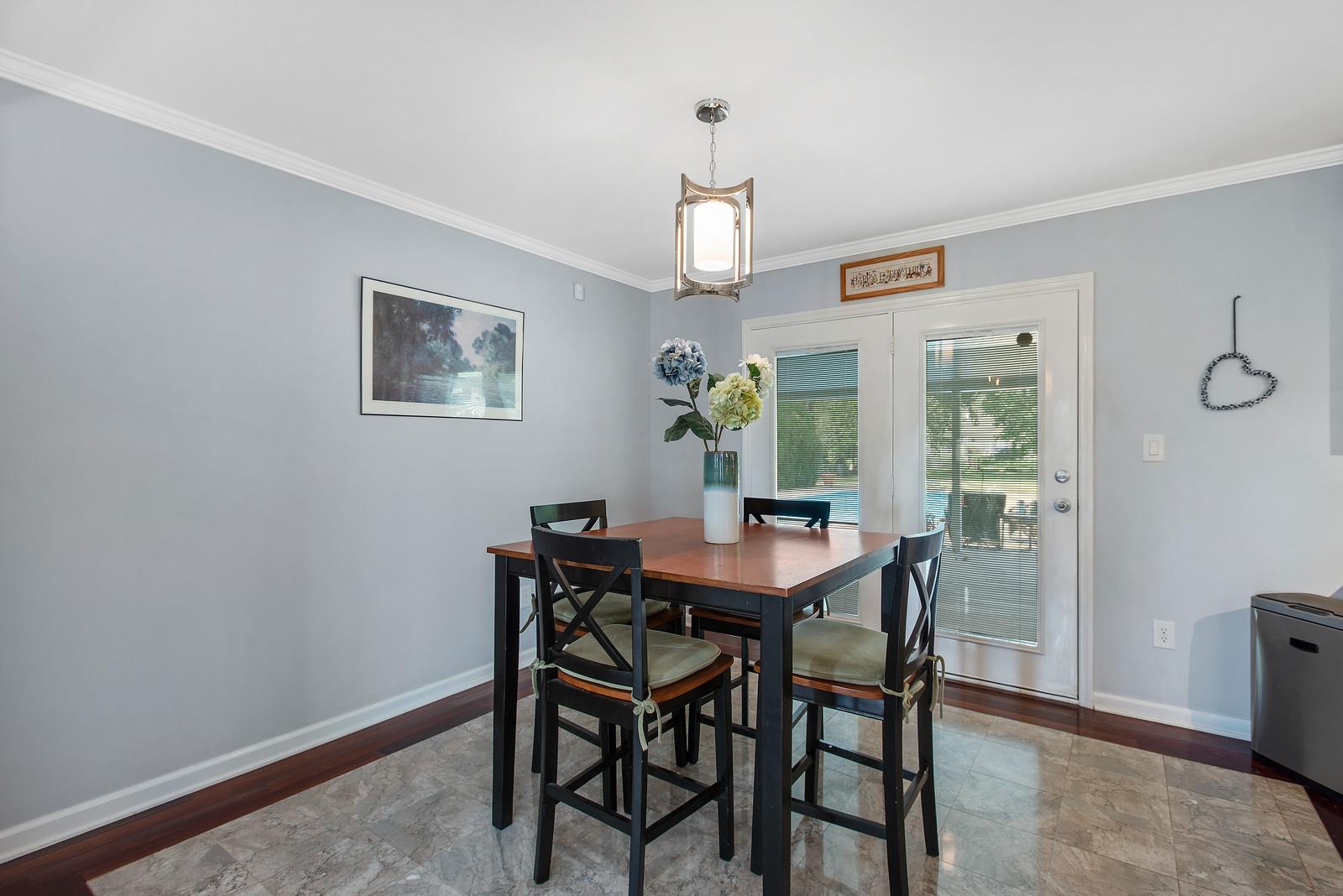 682 Baker Road Columbia, TN 38401 - Photo 8 of 30 a view of a dining room with furniture window and wooden floor