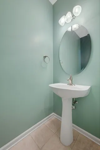 a bathroom with a sink and mirror