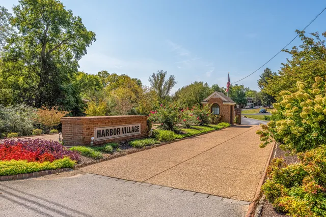 a pathway to a house with a yard