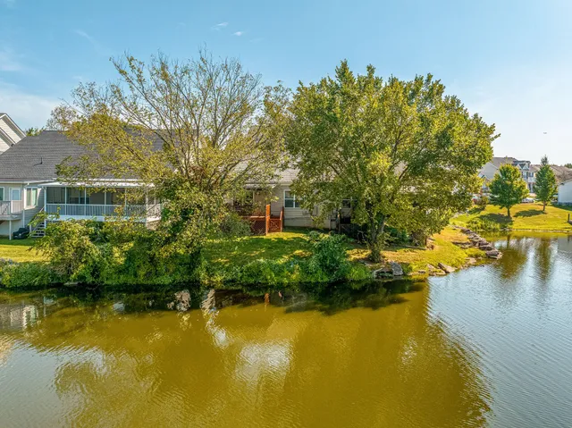 a view of a swimming pool with a yard