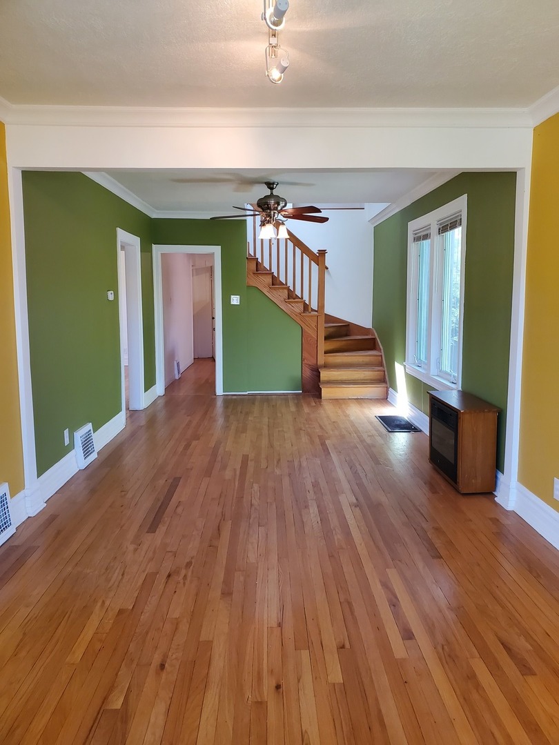 123 Northgate Road Riverside, IL 60546 - Photo 4 of 29 a view of an empty room with wooden floor and a window