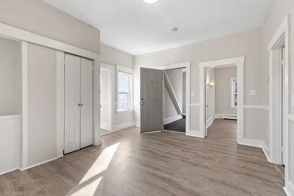 a view of entryway with wooden floor