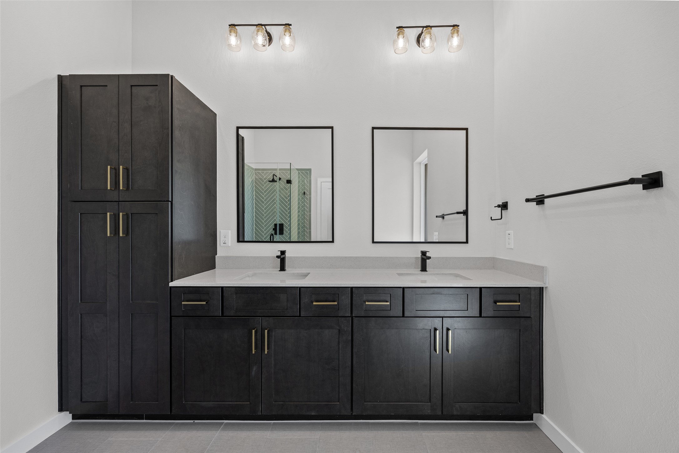 2000 Riverside Farms Road, Unit 5102 Austin, TX 78741 - Photo 18 of 25 A contemporary bathroom with dual vanities and sleek, dark cabinetry offers a refreshing daily retreat.