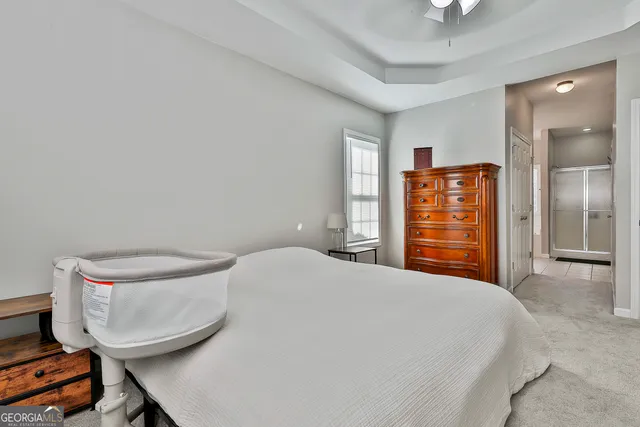 a bedroom with a bed and dresser