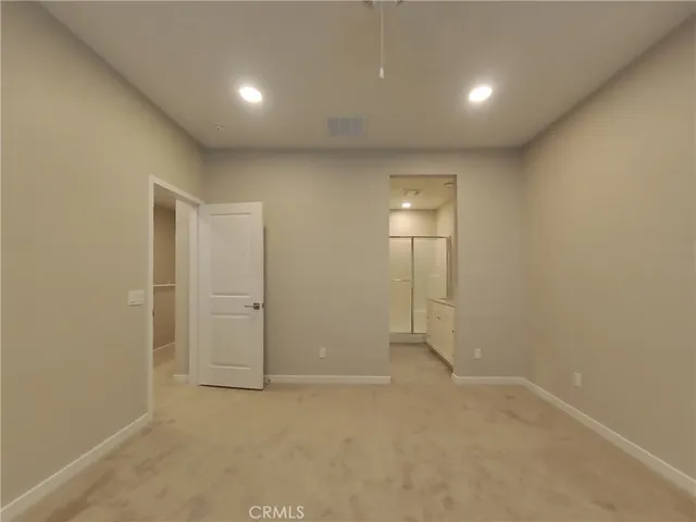 an empty room with a empty space and window