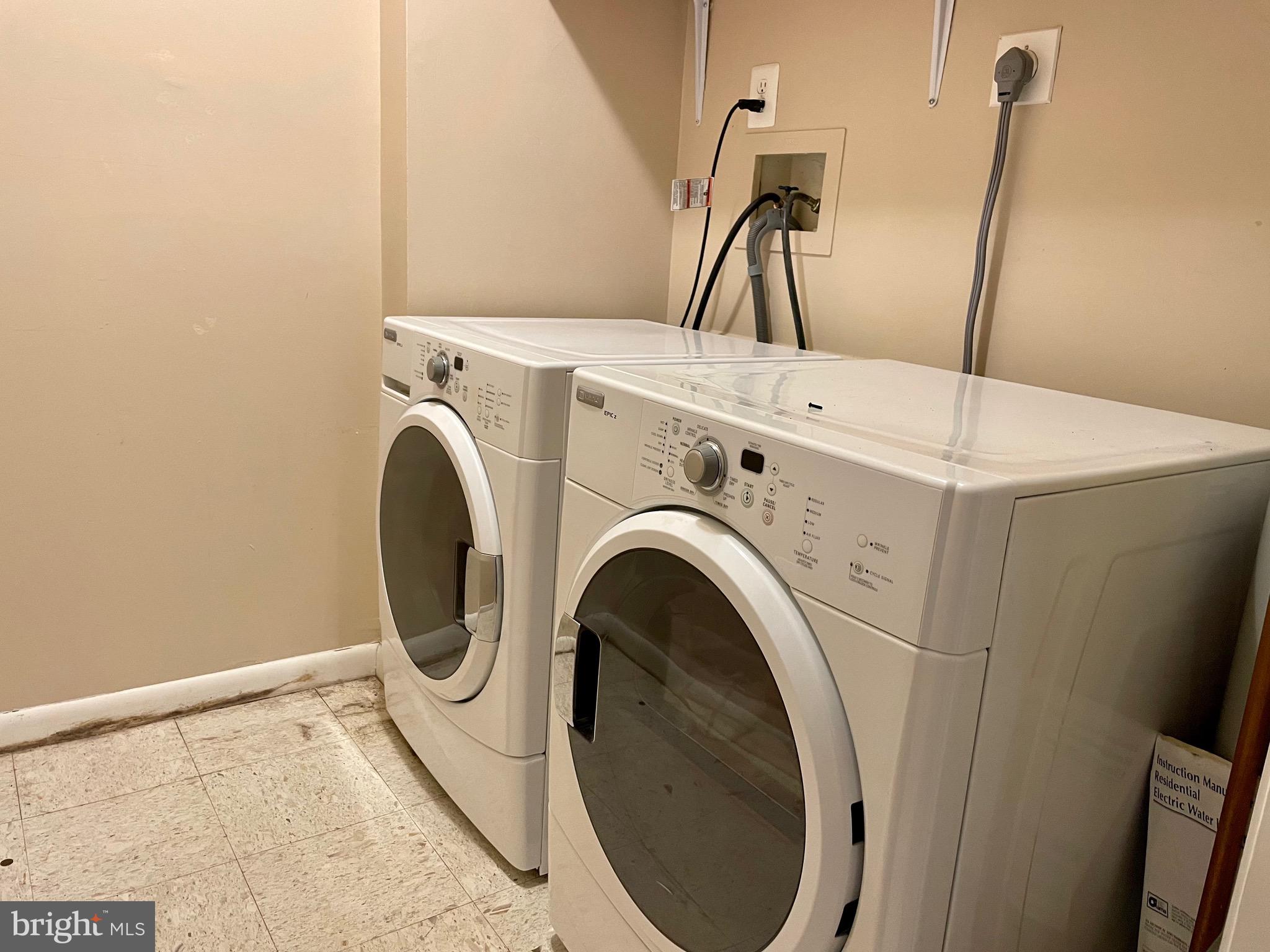 7 A Friendswood Court, Unit 7A Baltimore, MD 21209 - Photo 26 of 32 a utility room with dryer and washer