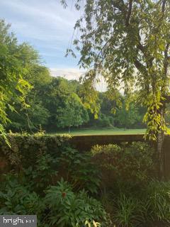 7 A Friendswood Court, Unit 7A Baltimore, MD 21209 - Photo 29 of 32 a view of a lake with a yard