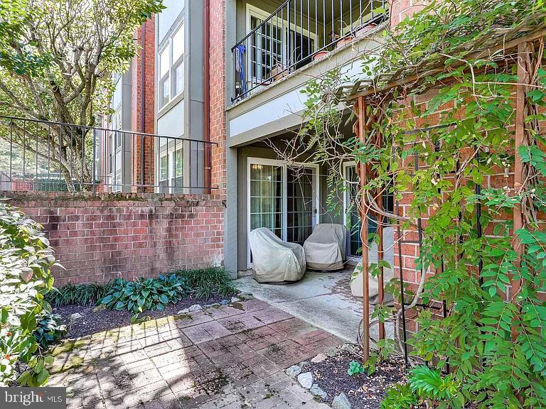 7 A Friendswood Court, Unit 7A Baltimore, MD 21209 - Photo 31 of 32 a view of a chair and table in the backyard