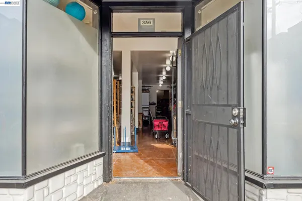 a view of a hallway with wooden shelves