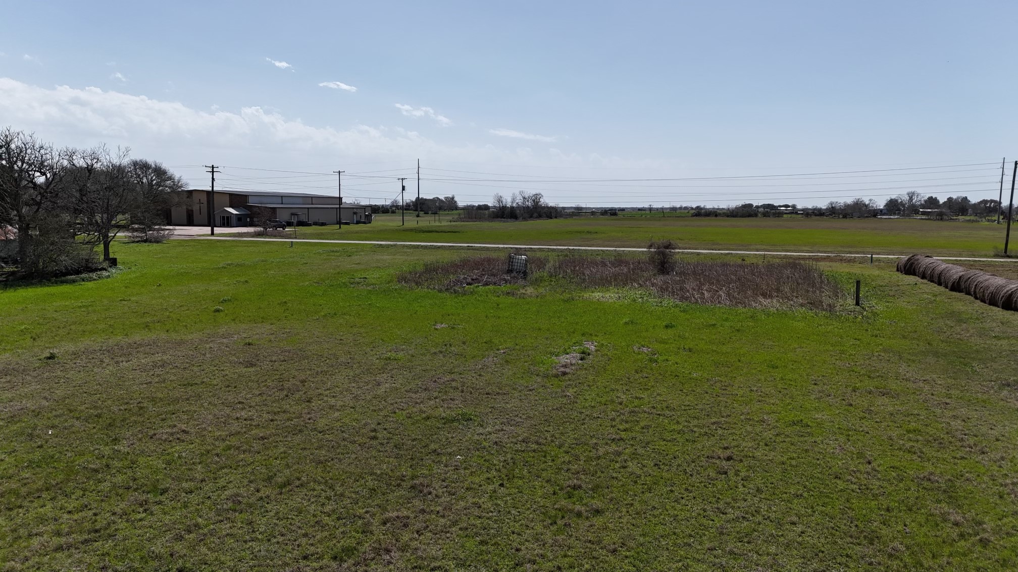 1-5 Block 709 Hempstead Tx 77445 Hempstead, TX 77445 - Photo 3 of 4 a view of a lake with houses in the background