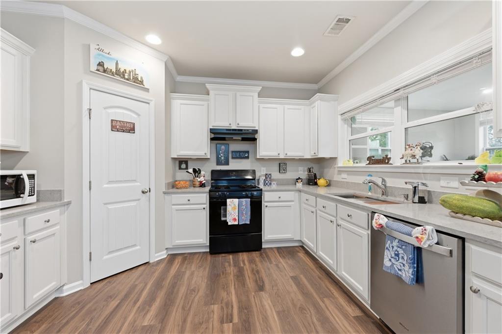 36 Birch River Court Dallas, GA 30132 - Photo 11 of 49 a kitchen with stainless steel appliances granite countertop a sink and cabinets