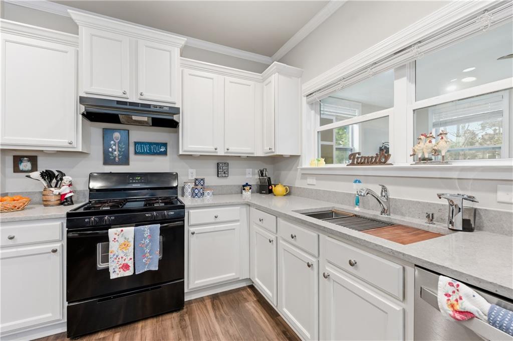 36 Birch River Court Dallas, GA 30132 - Photo 13 of 49 a kitchen with granite countertop white cabinets and white appliances