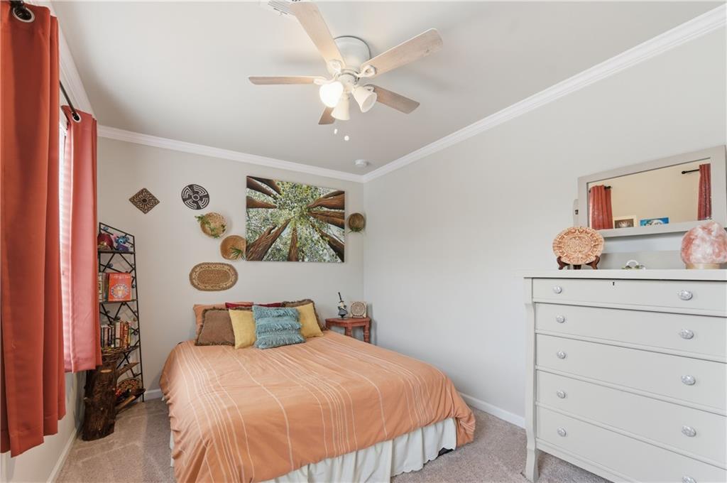 36 Birch River Court Dallas, GA 30132 - Photo 17 of 49 a bedroom with a bed and painting on the wall