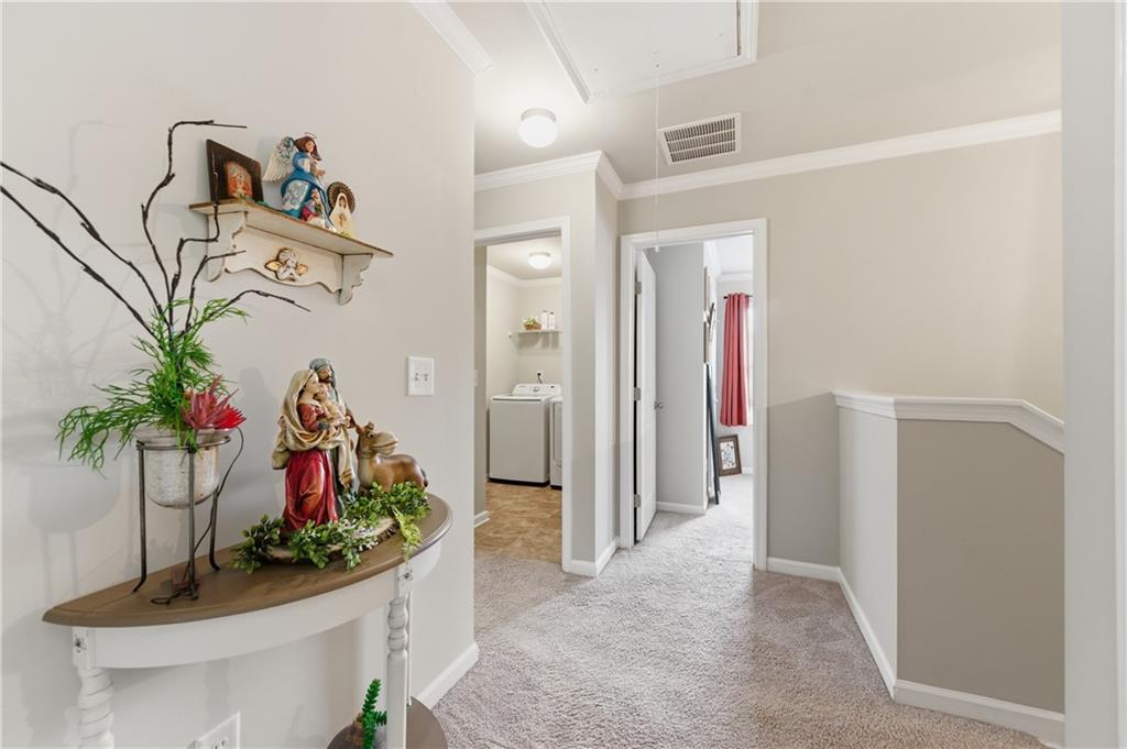 36 Birch River Court Dallas, GA 30132 - Photo 22 of 49 a view of a hallway with a flower pot and a table
