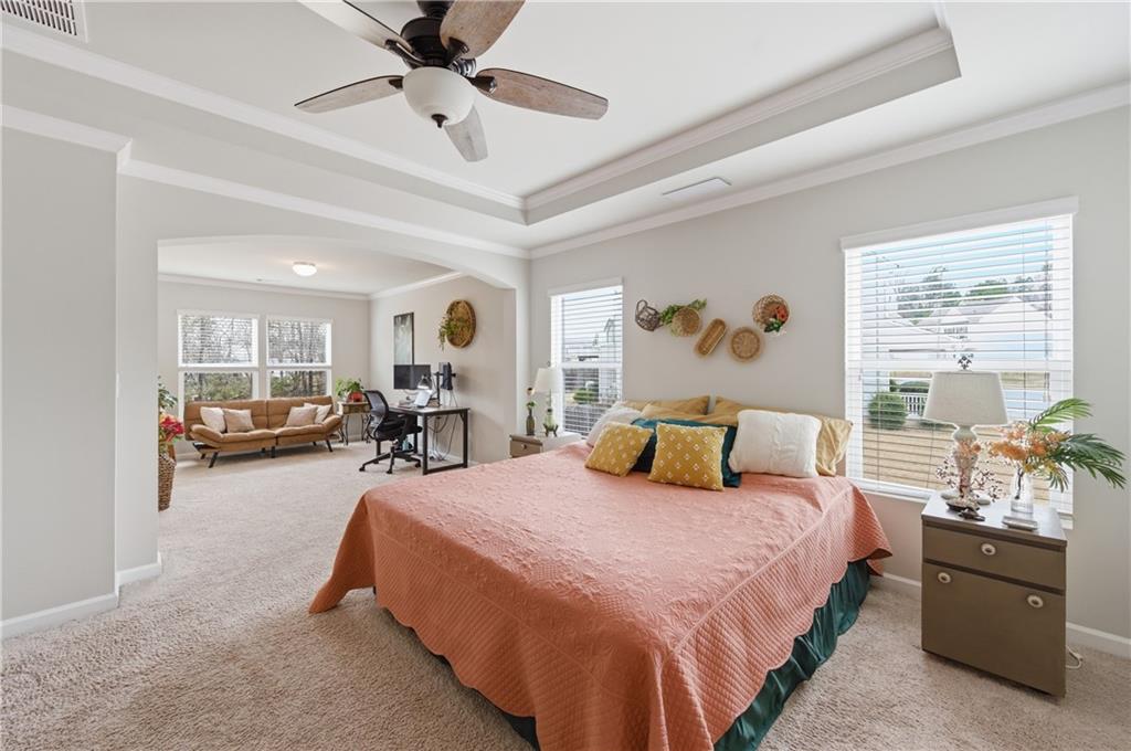 36 Birch River Court Dallas, GA 30132 - Photo 25 of 49 a bedroom with bed and a chandelier