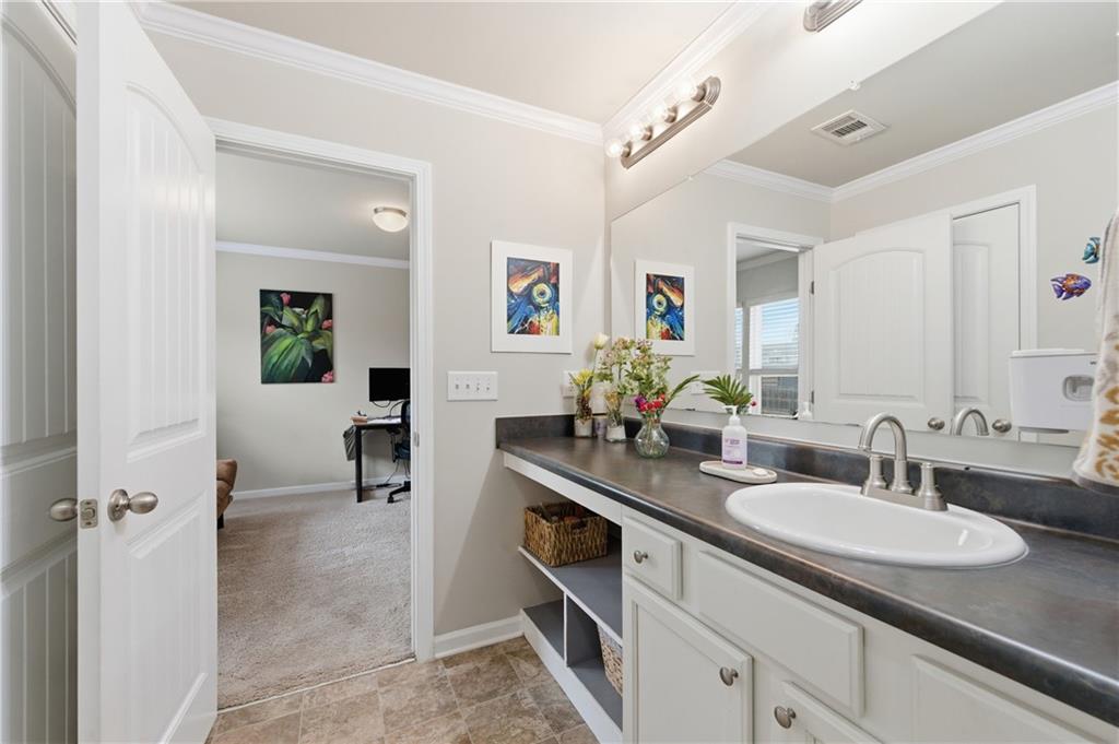 36 Birch River Court Dallas, GA 30132 - Photo 28 of 49 a bathroom with a granite countertop sink and a mirror