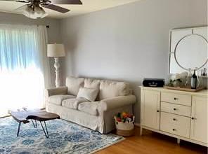 a living room with furniture and a lamp