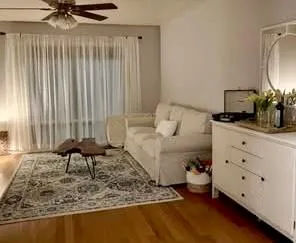 a kitchen with granite countertop a stove and a microwave