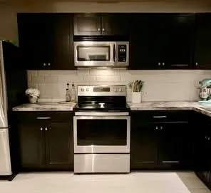 a kitchen with a sink and cabinets