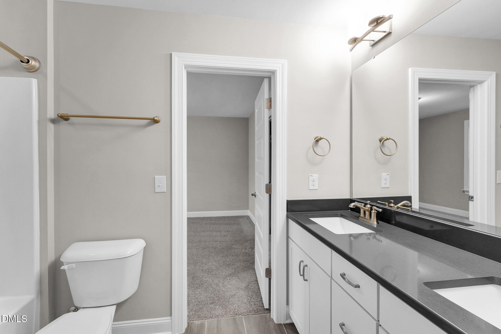 928 Barringer Drive Raleigh, NC 27606 - Photo 16 of 40 a bathroom with a sink and a mirror